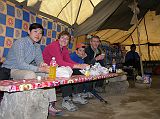 Tibet Kailash 08 Kora 18 Lunch Stop At Tamdrin Inside Gyan served us some curried potatoes, bread and juice, which I washed down with a Pepsi. Charlotte befriended the young Korean girl on the left, a girl named Sue, who joined our motley crew for the kora.